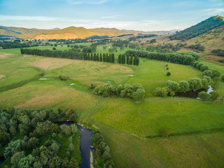 Aerial landscape of meadows and pastures of Mitta Mitta Valley near Eskdale, Victoria, Australia at sunset