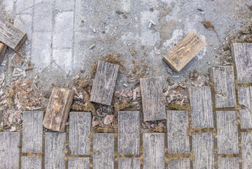 Damage to wooden floor of the street pavement