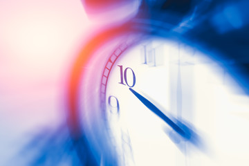 clock time with zoom motion blur focus at 10 o'clock, fast speed business hour concept.