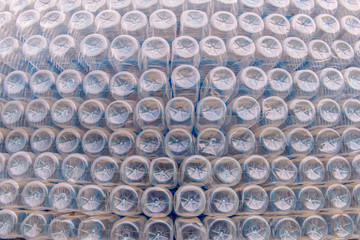 Stack of bottom plastic bottles texture for background