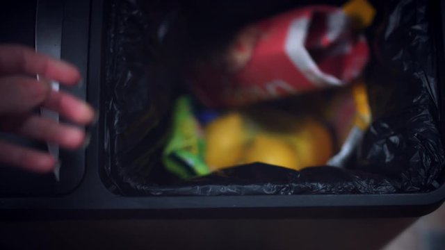 4k Shot of General Bin, Throwing to Trash Lemons