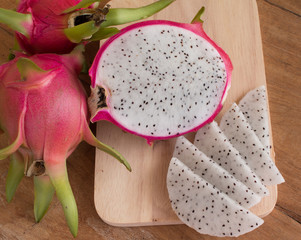 Dragon fruits on wooden background, Sliced delicious dragon frui