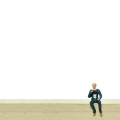 Obraz premium Selective focus, miniature people sitting on wooden block, busin