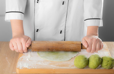 rolls the dough a rolling pin