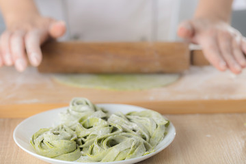 chef rolls the dough