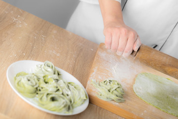 chef rolls the dough