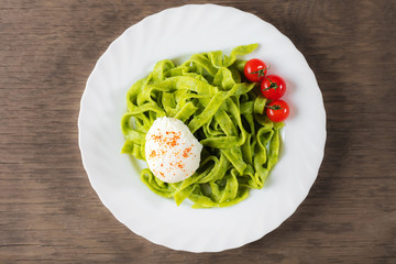 Spinach pasta with poached egg