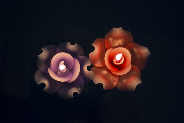 Couple candle on dark background.
