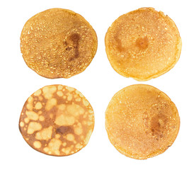Four different thin pancake on a light background