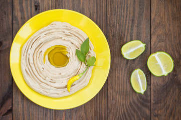 Hummus - mashed chickpeas appetizer, made up usually consists of olive oil, garlic, lemon juice, paprika, sesame paste.