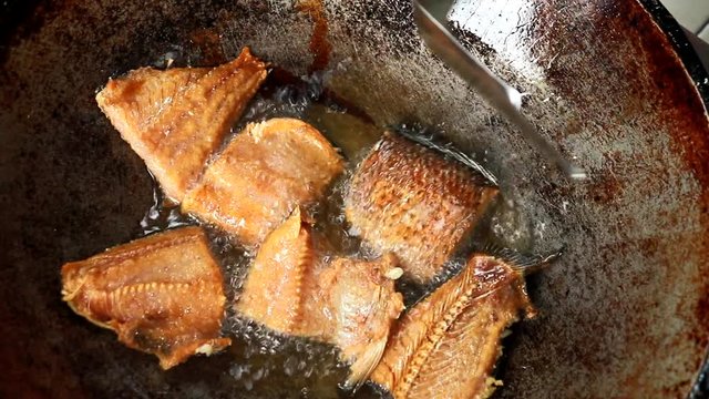 frying dried fish in pan