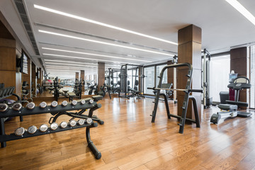 Modern gym interior with equipment.fitness center interior - obrazy, fototapety, plakaty