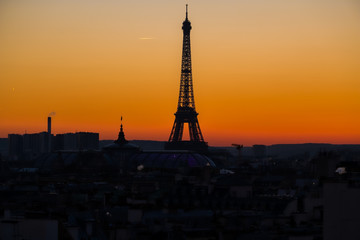 Eiffel tower at sunset from Parisian Rooftop