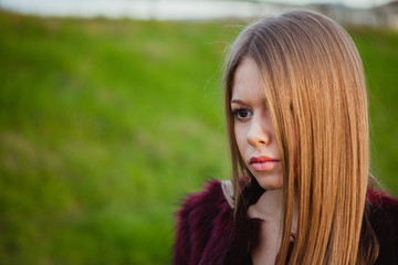 Naklejka premium Pretty blonde girl with a beautiful long