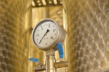 Close up of barometer mounted on industrial device 