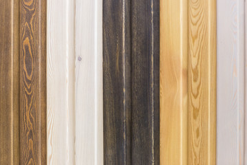natural wood colored background, rough texture of hardwood planks for floors and walls in the construction of the house