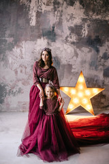 Fototapeta premium mother and daughter in the image of the queen and the princess i