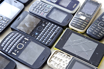 Old mobile phones isolated on white background