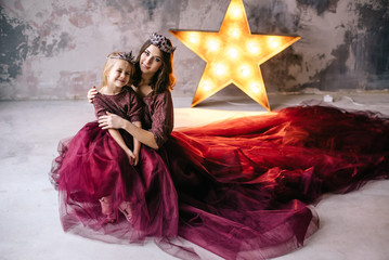 Fototapeta premium mother and daughter in the image of the queen and the princess i