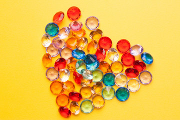 multicolored stones on a yellow background