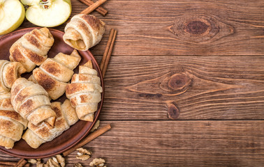 Obraz na płótnie Canvas Fresh homemade croissants with apple.