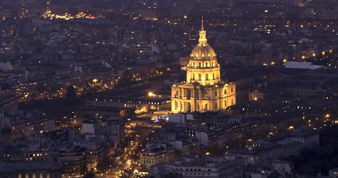 Aerial time lapse view of the Hotel des Invalides in Paris at night with artificial light