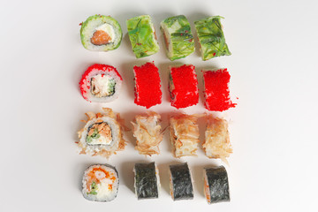 Set of rolls with smoked salmon, eel, chuka salad and flying fis