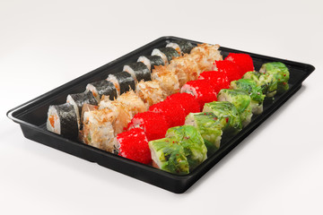 Plastic tray with set of rolls with smoked salmon, eel, chuka sa
