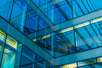futuristic glass facade of office building