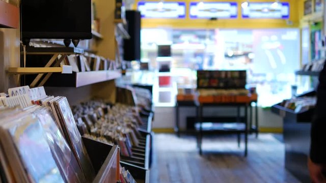 Man walking out of a vinyl record store