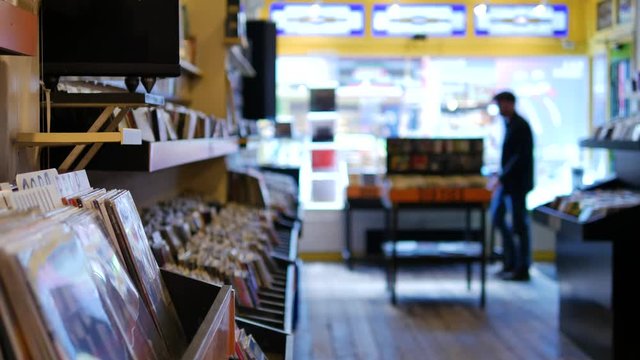 Man walking into a vinyl record store