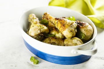 Baked chicken legs with pesto and buttermilk