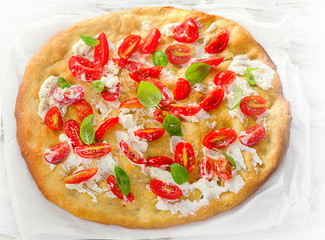 Focaccia with tomatoes, cream cheese and basil