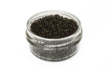 Fototapeta na wymiar Black caviar in a glass jar closeup isolated on white background