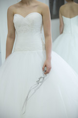 Bride white wedding dress with tulle cloth, shallow focus and verticle