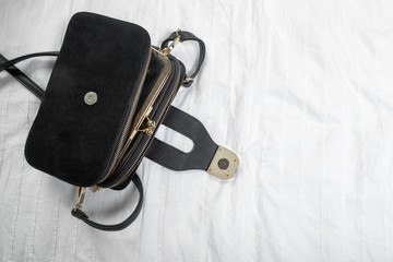 Female bag on white textile