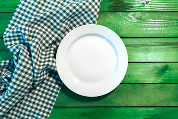 the plate on checkered table cloth