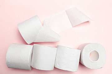 Toilet paper on pink background