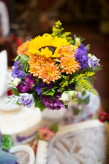 Obraz na płótnie Canvas Bouquet of yellow and purple flowers, handmade, celebration, vertical