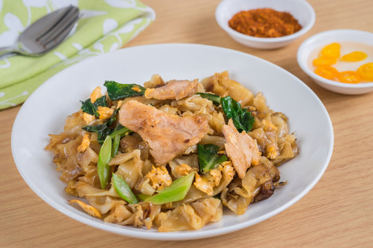 Stir fried rice noodle with pork on plate