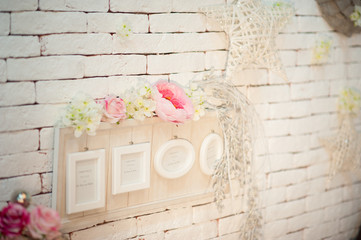Decoration ot the room with frame for photos on white wall background, wedding engagement concept
