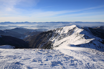 The slopes of the mountains lit by the sun that rises. Carpathians.