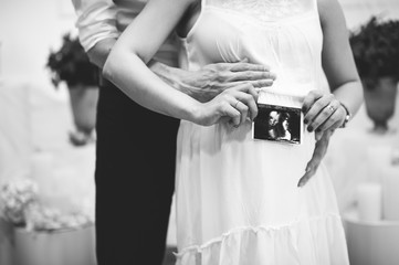 Baby on board photo session, pregnant couple, abstract, black and white