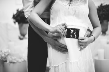 Baby on board photo session, pregnant couple, abstract, black and white