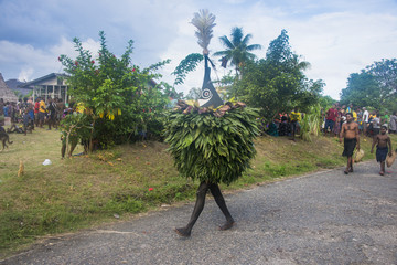 Traditional masked man at a Taboo death ceremony, East New Britain, Papua New Guinea