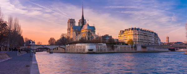 Picturesque panorama of Cathedral of Notre Dame de Paris at sunset, France