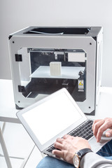 Designer Working With 3D Printer