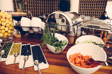 Setting of table with food for breakfast, shallow focus, lunch in hotel, vintage