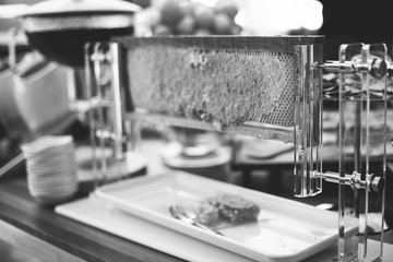 Setting of the table with food for breakfast, beverage in buffet, honey, black and white