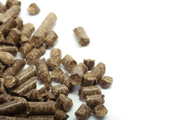 stack of wooden pellets for bio energy, white background, isolated